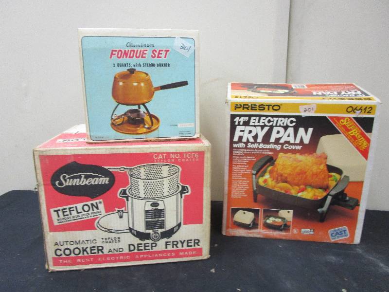 lot 120 image: Unused still in boxes, 11 electric fry pan, deep fryer, and a fondue set