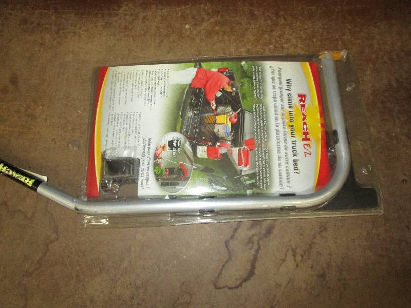 lot 57 image: Reach E-Z Get stuff out of your truck bed, hang up flowers and it will make it all easier