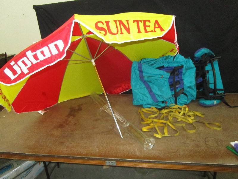 lot 60 image: hiking backpack and beach unbrella