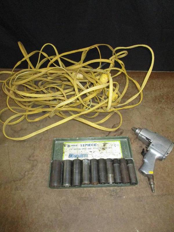 lot 79 image: Delta Air Wrench, extension chord and sockets