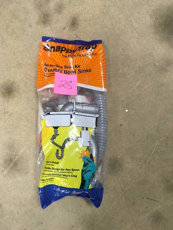 lot 28 image: SNAPPYTRAP 1-12 in. All-in-One Drain Kit for Double Bowl Kitchen Sinks not used