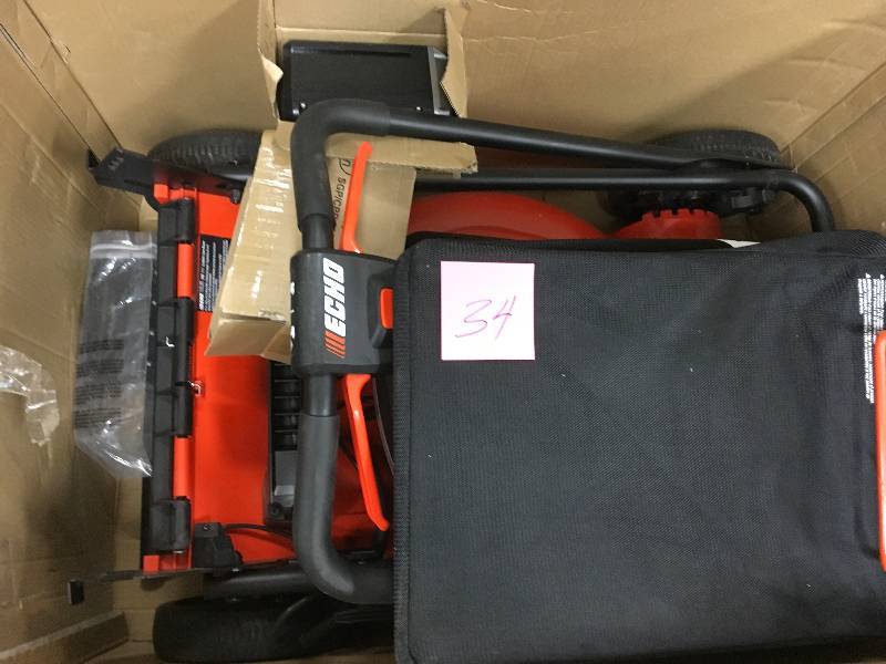 lot 34 image: ECHO 21 in. 58-Volt Brushless Lithium-Ion Cordless Battery Walk Behind Push Lawn Mower - 4.0 Ah BatteryCharger Included Missing 2 plastic push pins for battery cover & Bottom of bagger is cracked