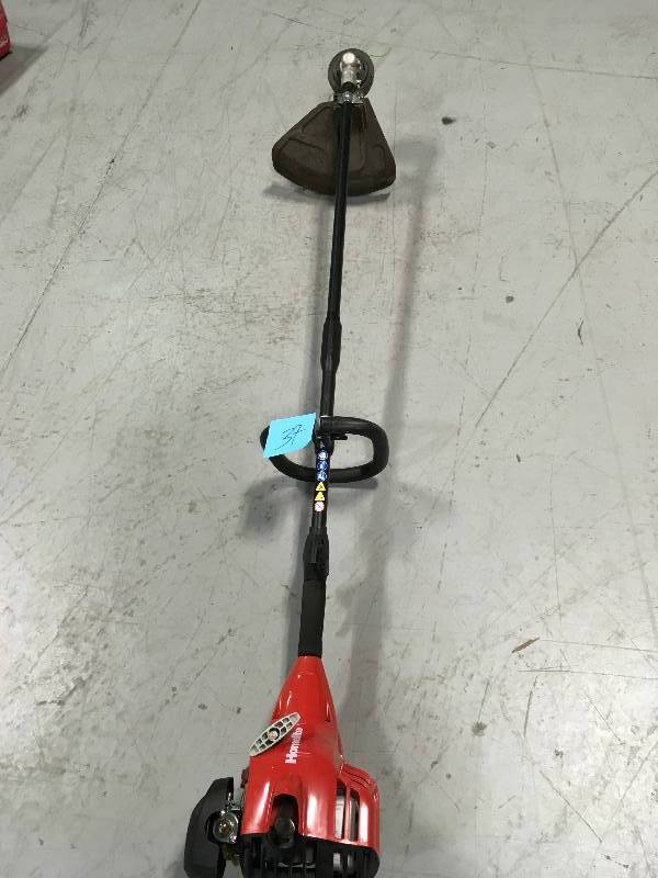 lot 37 image: Homelite 2-Cycle  Straight Shaft Gas Trimmer in working conditions