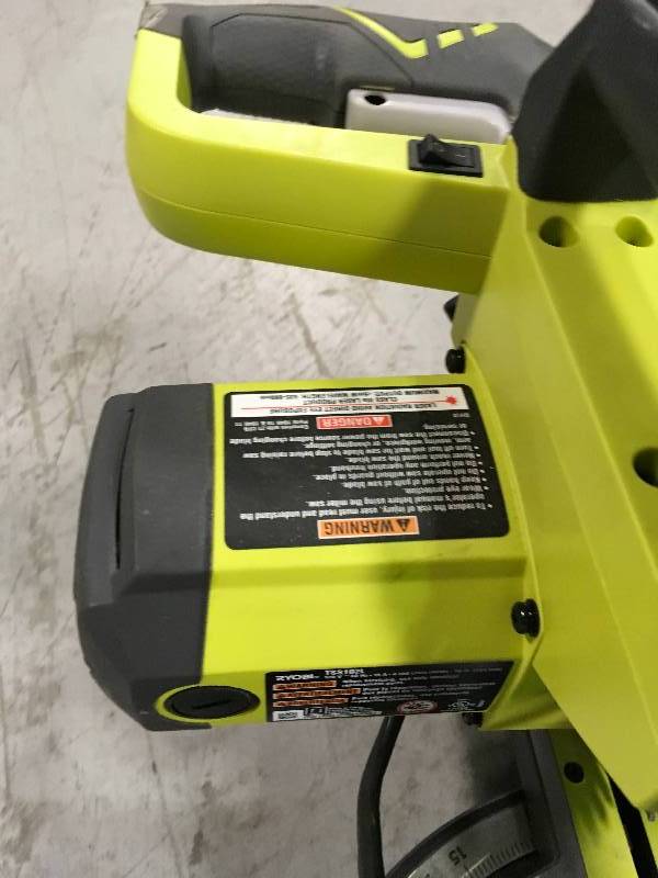 lot 39 image: Ryobi 15 Amp 10 in. Sliding Miter Saw with Laser used no bag in working condition