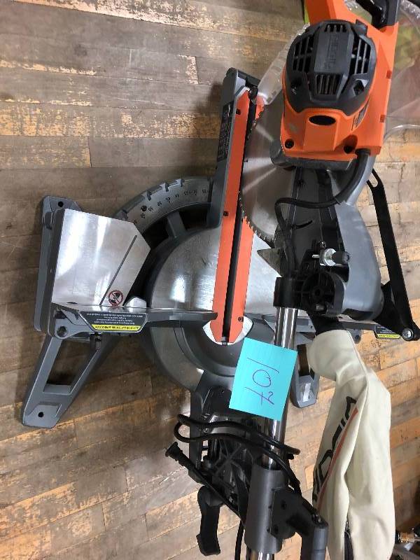 lot 107 image: RIDGID 15 Amp 12 in. Corded Dual Bevel Sliding Miter Saw with 70° Miter Capacity in working conditions