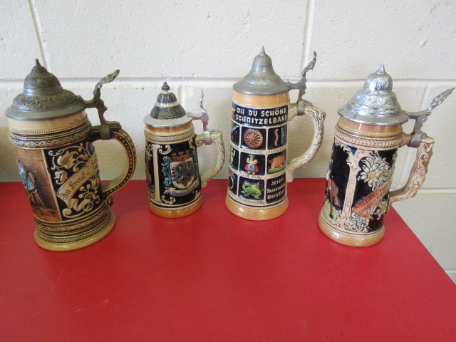 lot 405 image: VINTAGE 4 GERMAN MADE BEER STEINS WITH CAPS