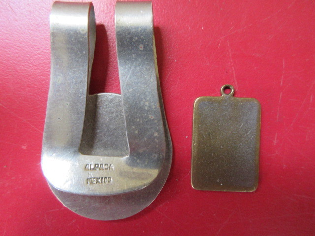 lot 444 image: MONEY CLIP AND TAG