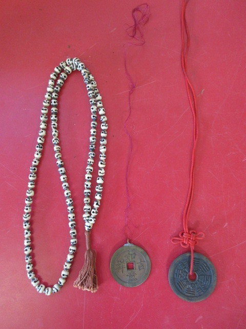 lot 450 image: BUDDHISM SKULL BEADS AND ASIAN MEDALLIONS
