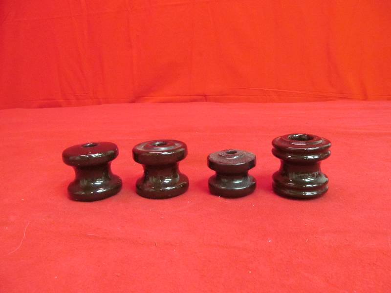 lot 104 image: brown ceramic insulators