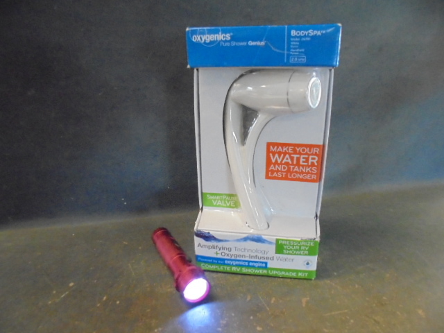 lot 71 image: Oxygenics RV Shower Upgrade Kit and Flashlight
