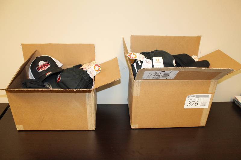 lot 376 image: Lot of (2) Boxes of T-Shirts, Baseball Caps