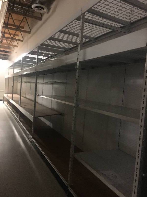 lot 23 image: LONG RUN OF MADIX BRAND LOZIER  GONDOLA RETAIL SHELVING APPROX 90 RUN 36 DEEP - 7 TO 9 TALL ALL MEASUREMENTS ARE APPROXIMATE