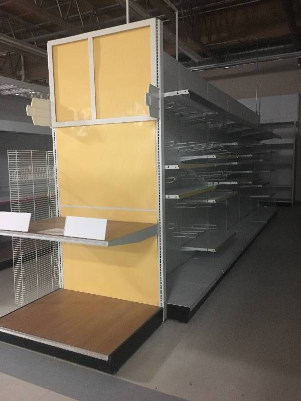 lot 24 image: LONG RUN OF MADIX BRAND LOZIER  GONDOLA RETAIL SHELVING APPROX 28 RUN 36 DEEP - 7 TO 9 TALL ALL MEASUREMENTS ARE APPROXIMATE