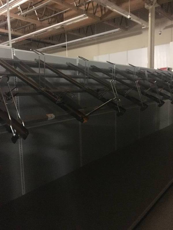 lot 26 image: LONG RUN OF MADIX BRAND LOZIER  GONDOLA RETAIL SHELVING  BIKE RACKS ON THIS RUN APPROX 80 RUN 36 DEEP - 7 TO 9 TALL ALL MEASUREMENTS ARE APPROXIMATE