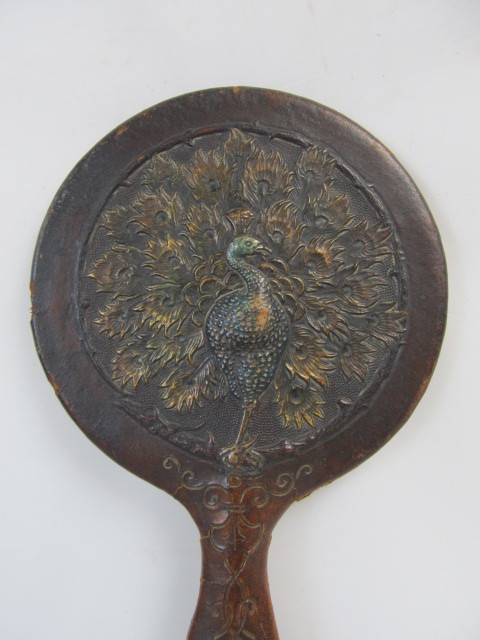 lot 41 image: Antique Art Nouveau Hand Tooled Leather Peacock Hand Mirror
