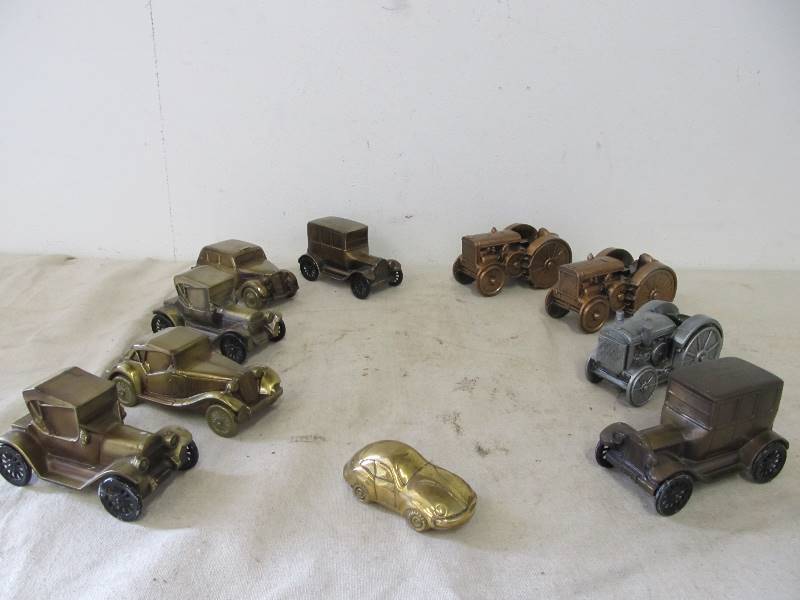 lot 141 image: Large Lot of Vintage Brass Car & Tractor Banks