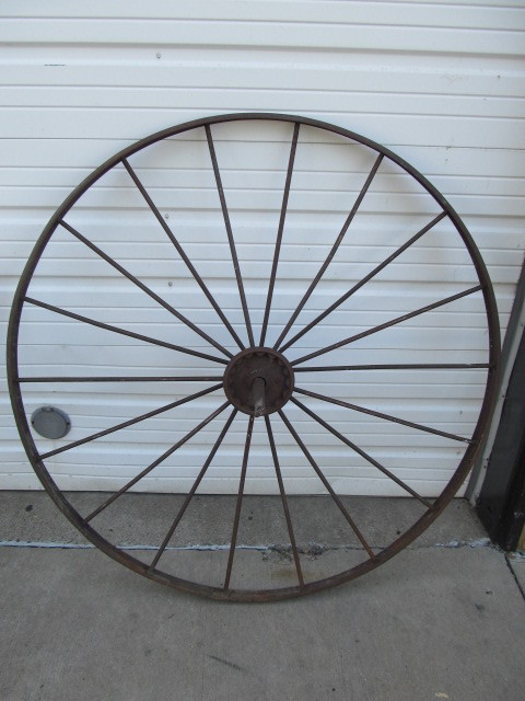 lot 84 image: Huge Antique Iron Wagon Wheels