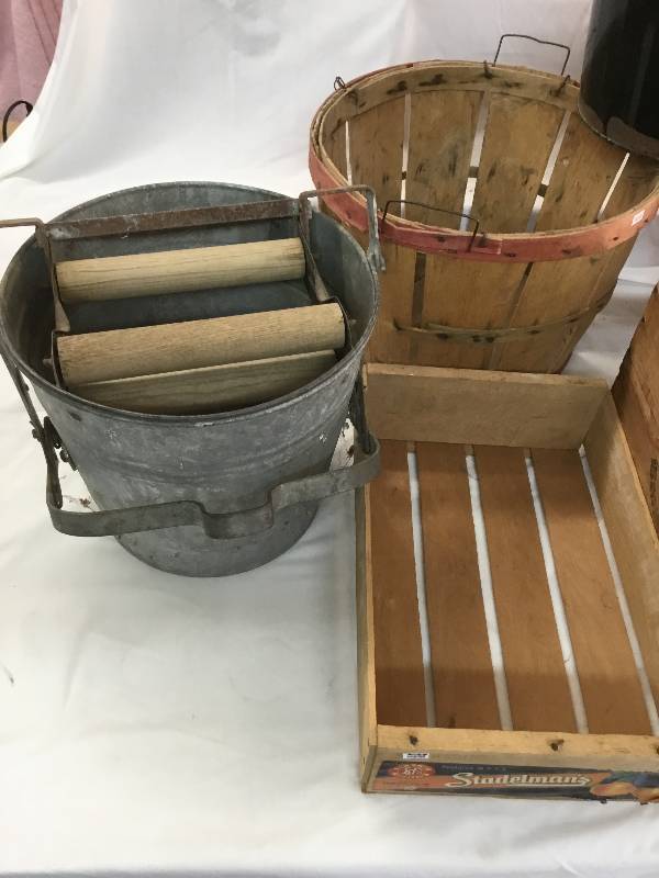 lot 37 image: Metal mop bucket, wooden baskets, two metal pails, 2 wooden crates and 2 old bottles Germany beer.