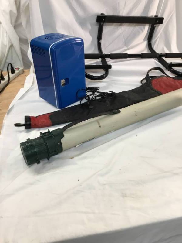 lot 96 image: Hot Rod magazines Gun bag, Fishing rod case , pull up bar and small portable fridge