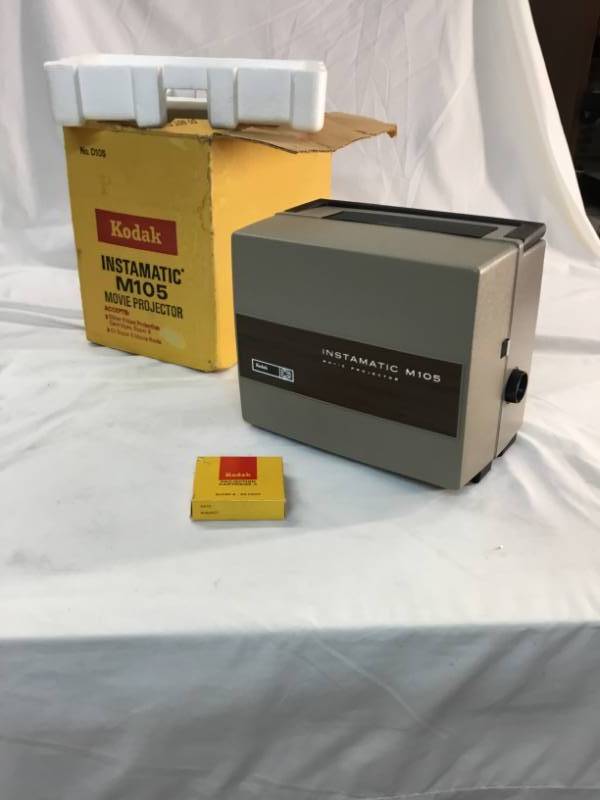 lot 93 image: Vintage Kodak instamatic M105 movie projector with box