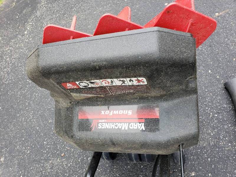 lot 17 image: Yard Machines Snow Fox Electric Plow, Earthwise Electric Blower