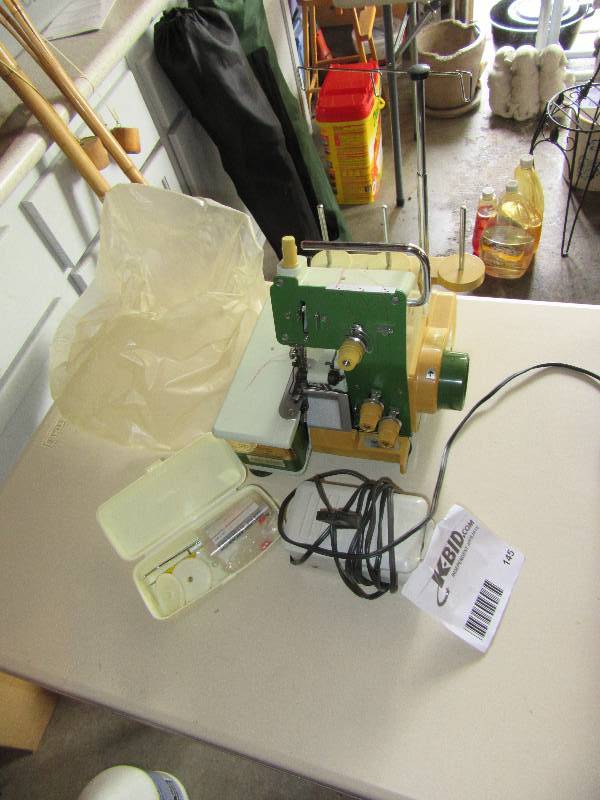 lot 145 image: Serger Self contained Sewing machine