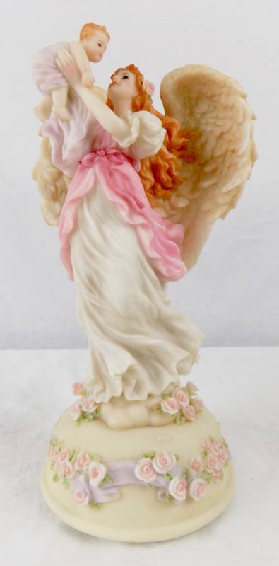 lot 22 image: (Retired) Musical Seraphim Classic - New Baby Angle Figurine  Skip-Hop Baby Bag  (new) Lighting Remote Control