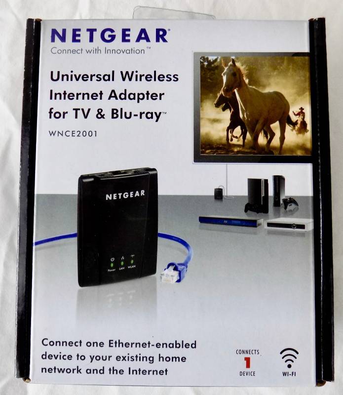 lot 27 image: NetGear Wireless Internet Adapter for TV & Blu-ray  Vintage Garmin Navigation GPS  Vintage iHome clock-radio w Apple docking
