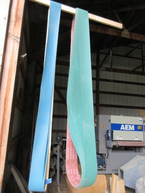TWELVE 4 X 132 SANDPAPER BELTS.