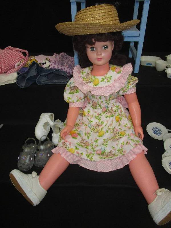 lot 173 image: 32 Tall Doll with Some Extra Clothes, Potty Chair, Toy Plates