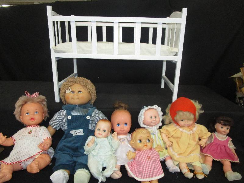 lot 175 image: 9 Assorted Dolls and 2 Crib
