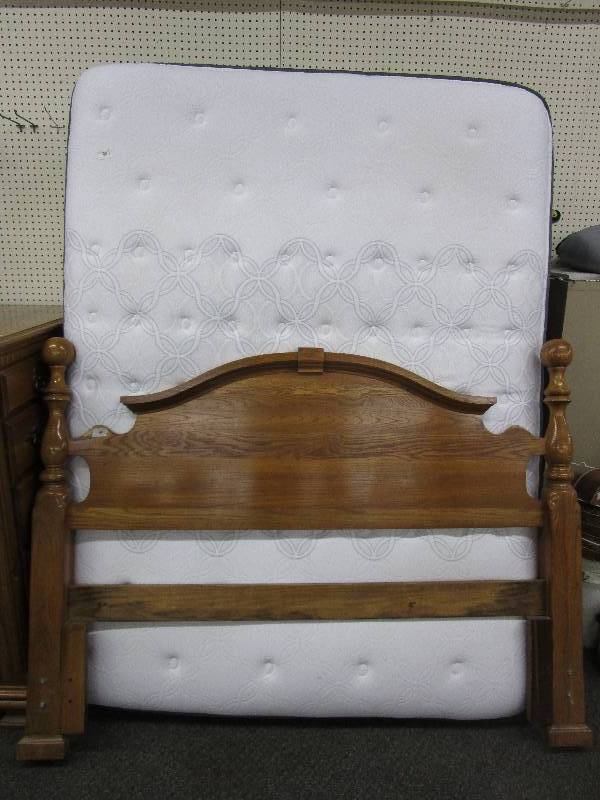 lot 1 image: Nice Oak Headboard, Queen Size Mattress, Box Spring, Still Has Store Tags On It