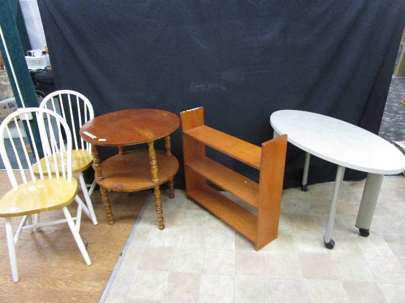 lot 70 image: Round Table, Bookshelf, Oval Table on Wheels, 2 Blonde Chairs