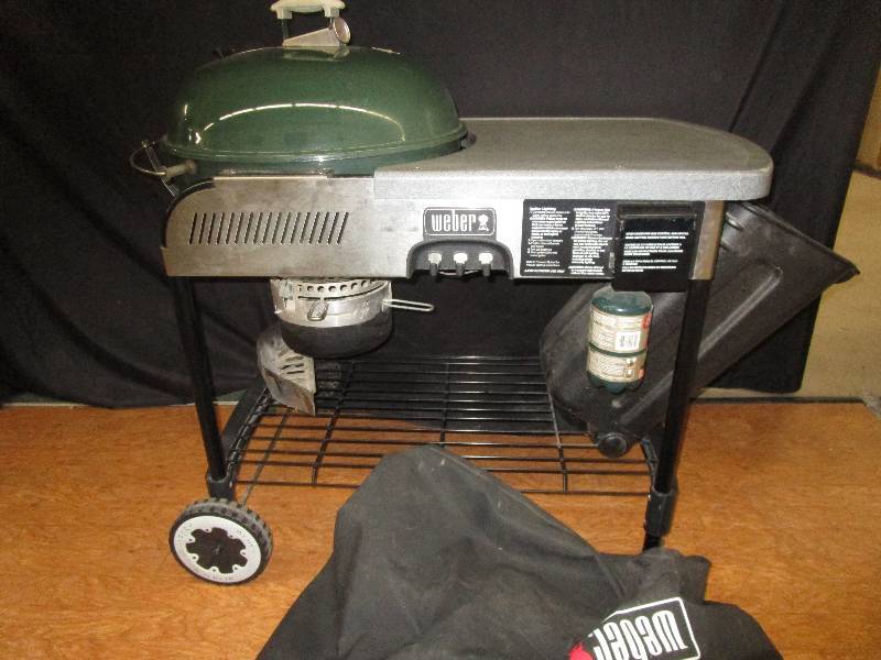 lot 80 image: Propane Webber Grill with cover, very nice grill and workspace