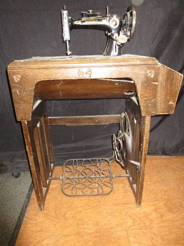 lot 83 image: Brunswick Sewing machine and antique cabinet 27 x 15x 29 h