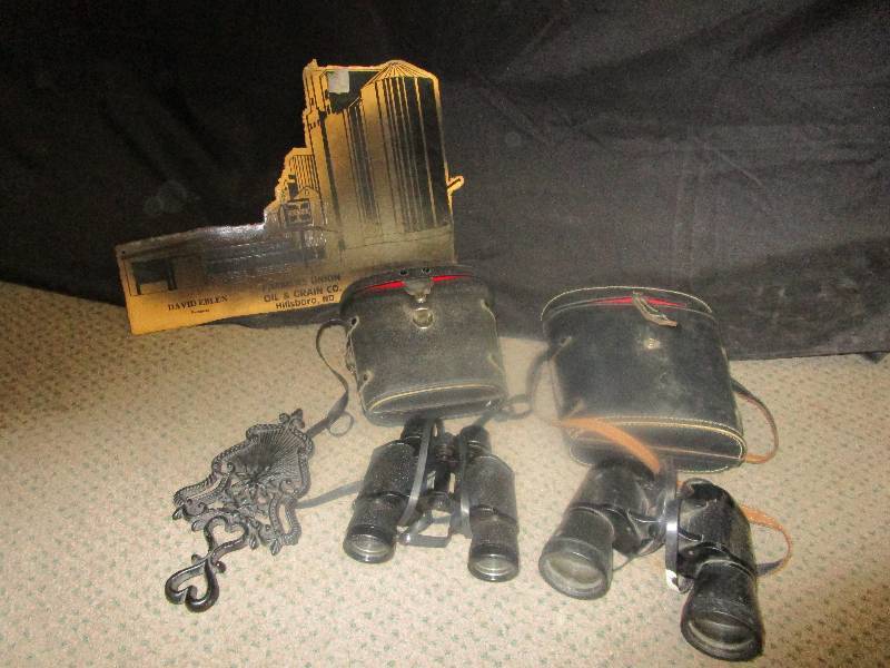 lot 100 image: 2 pairs of Binoculars, a Farmers Union Oil and Frain Company Hillsboro metal sign cut out and a trivet
