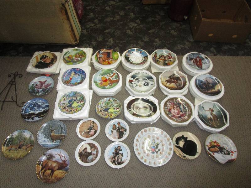 lot 122 image: Lots of Collector Plates, Gone With the Wind, Cinderella, Snow White, Pooh Bear, Mystic Warriors Plate Collection, First Kiss, Country Carnival, Barnyard Gathering, Wildlife, Indian Summer, Eagles, Winter White Tails, Norman Rockwell