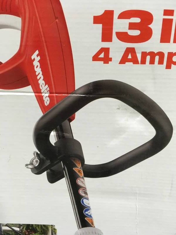 lot 8 image: Homelite 13 in. 4 Amp Straight Electric String Trimmer  in good working condition