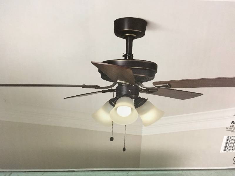 lot 5 image: Hampton Bay Sinclair 44 in. Indoor Tarnished Bronze Ceiling Fan with Light Kit not used