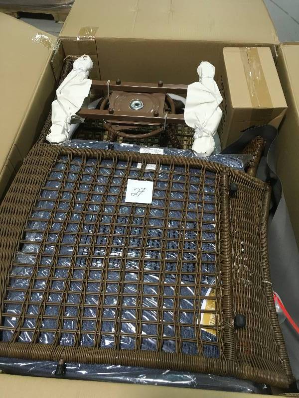 lot 27 image: Spring Haven Brown All-Weather Wicker Outdoor Patio Swivel Rocking Chair with Sky Blue Cushions