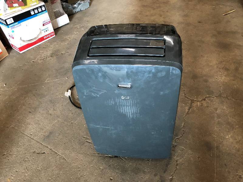 lot 114 image: LG Electronics 12,000 BTU (7,000 BTU, DOE), 115-Volt Portable AC w Dehumidifier Function in working conditions