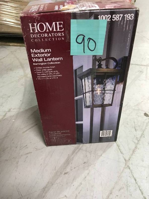 lot 90 image: 1-Light Golden Bronze Outdoor 7.5 in. Wall Mount Lantern with Clear Water Glass not used