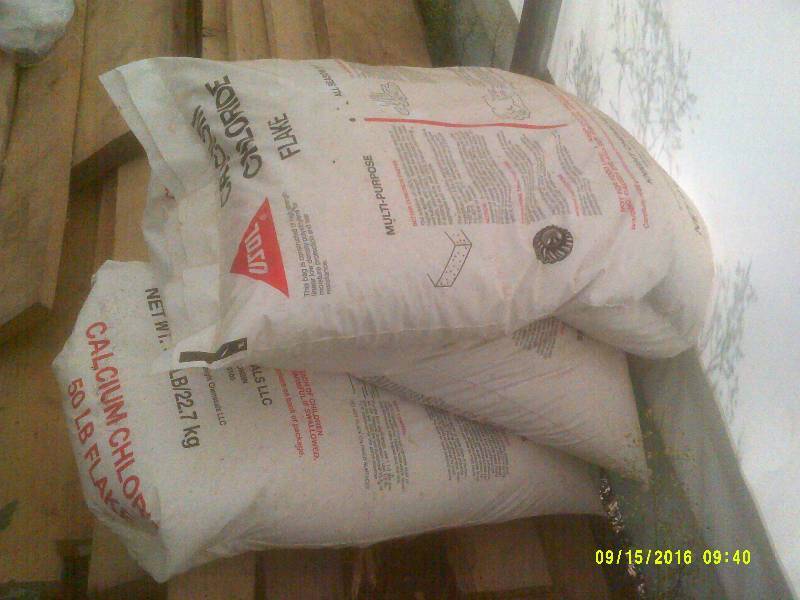 2 BAGS CALCIUM CHRORIDE FLAKE