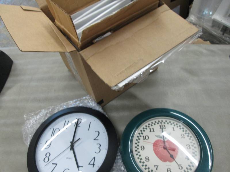 6 White Binders, 2 Wall clocks...
