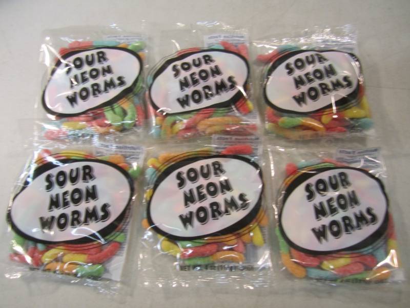 lot 211 image: 6 Bags of Sour Neon Worms Best by F...