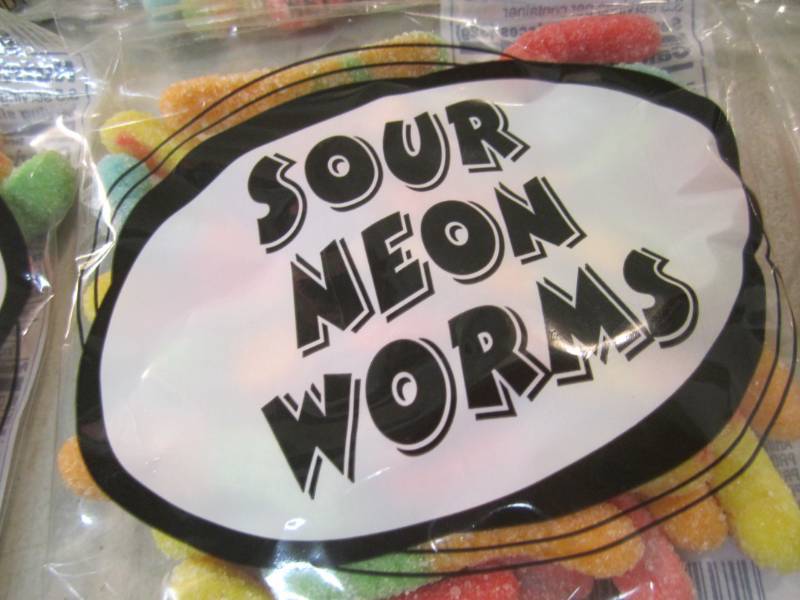 lot 212 image: 6 Bags of Sour Neon Worms Best by F...