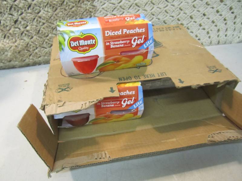 lot 228 image: Case of 6 4-Packs of Del Monte Dice...