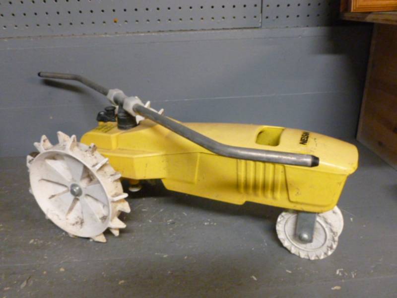 lot 38 image: Cast Iron Tractor Sprinkler