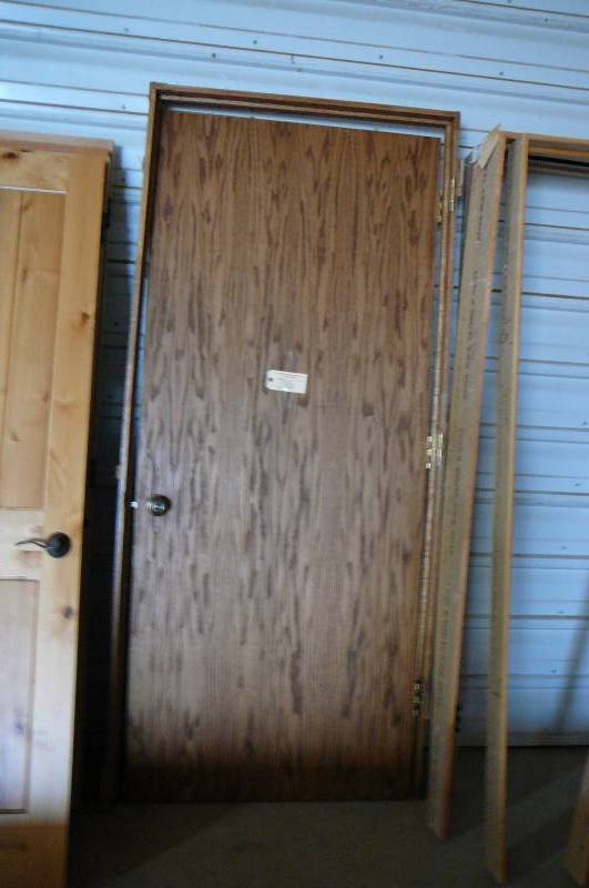 lot 716 image: Wood Door with Jamb and Hardware