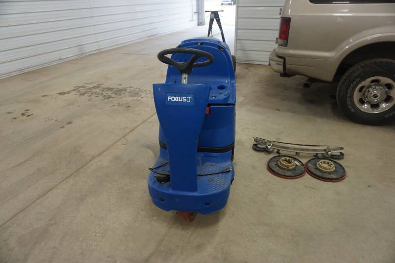 lot 6 image: Clark Model Focus II Microrider Battery Powered Ride On Floor Scrubber